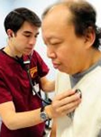 Patient getting checked by stethoscope
